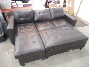 lot 49 image: Leather sectional sofa with ottoman