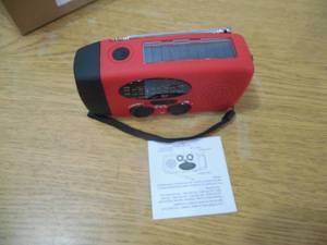 lot 74 image: SolarHand CrankUSB Emergency Weather Radio with Flashlight