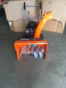 24 in. Two-Stage Electric Start Gas Snow Blower by YARDMAX in working conditions
