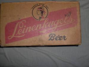 Leinenkugels cardboard beer case. 7 oz. Decent shape. Has writing on inside one flap. As shown.
