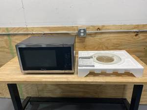 lot 49 image: MAGIC CHEF 1.1 cu. ft. Countertop Microwave in Stainless Steel with Gray Cavity
