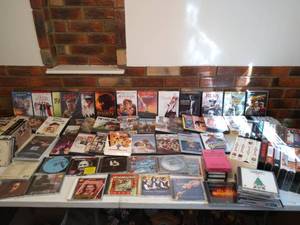 Collection of CDs, DVDs, and VHS Tapes