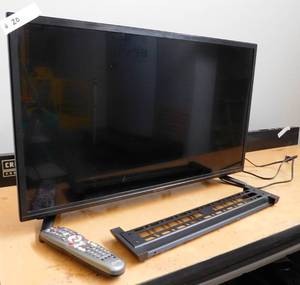 lot 20 image: 32 Roku TV with Wall Mount Bracket