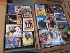 2 boxes of  assorted sports cards i...