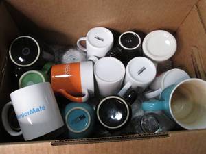 Box of coffee mugs to stock at the ...