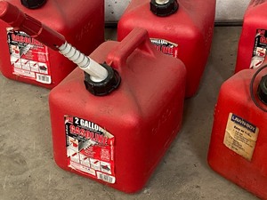 lot 39 image: Lot Of (9)  Assorted Gas Cans