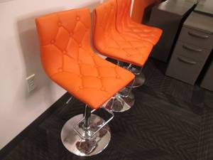 (3) Orange Adjustable Swivel Chairs...