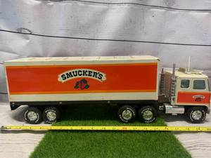 lot 61 image: Vintage Nylint GMC Smuckers 18 Wheeler Semi Truck (Sold $70.00 Ebay)