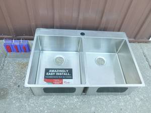 New stainless 2 compartment sink. Has minor shipping damage on corner. As shown.