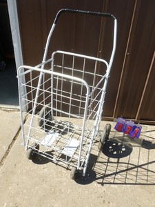 Folding shopping cart. New. As shown.