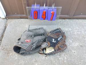 Qty of 2 ball gloves. Rawlings & louisville slugger. As shown.