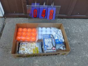 Flat of golf items. As shown.