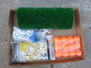Flat of golf items. As shown.