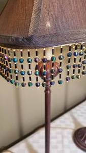 lot 187 image: Pair of Tall Bronze Candlestick Lamps with Beaded Fringe