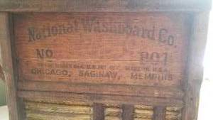 lot 87 image: Vintage Laundry Room Collectibles  Sad Iron, Washboard, Sock Form & Ironing Board