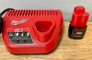 lot 56 image: Milwaukee Tool M12 Charger and 1.5Ah Battery Lot