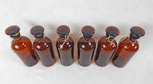 lot 18 image: Set of 6 Vintage Mercer Glass Works 16 OZ Amber Glass Bottles With Mushroom Stoppers