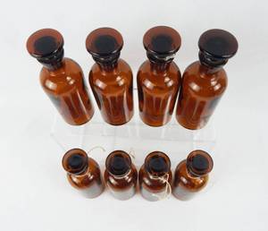 lot 30 image: Set of 8 Vintage Mercer Glass Works 125 ML Narrow Mouth Amber Glass Bottles With Mushroom Stoppers