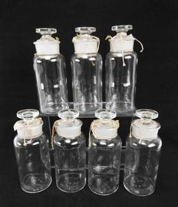 lot 52 image: Set of 7 Vintage Mercer Glass Works 8 OZ Wide Mouth Flint Glass Bottles With Mushroom Stoppers