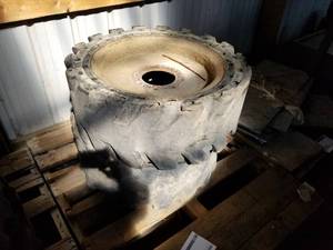 lot 285 image: Lot of (2) Solid Rubber Industrial Tire 33X12- On 8-Bolt Steel Rim (on pallet)
