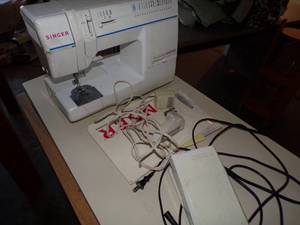 Sewing machine and table