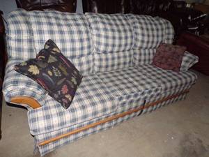 Greenish hide-a-bed couch w pillows
