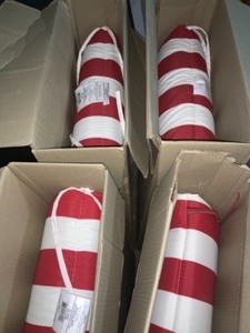 lot 31 image: 21.5 X 72 IN. X 4 IN. RED CABANA STRIPE OUTDOOR CHAISE LOUNGE CUSHION. SEE PICTURES