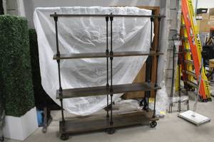 lot 16 image: Bookshelf 4-shelf 63Wx14Dx72H with Decorative Wheels