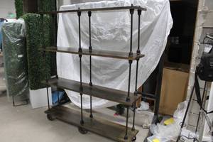 lot 116 image: Bookshelf 4-shelf 63Wx14Dx72H with Decorative Wheels