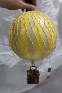 lot 30 image: Authentic Models Travels Light Hot Air Balloon Basket Dcor Yellow (in box)