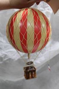 lot 132 image: Authentic Models Travels Light Hot Air Balloon Basket Dcor Red (in box)
