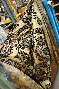 lot 99 image: Lot of (2) Tablecloth Black & Tan Print 120D