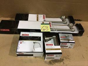 lot 63 image: MIX LOT OF DELTA TOWEL RING, TOILET PAPER HOLDER ETC. Customer Returns See Pictures 