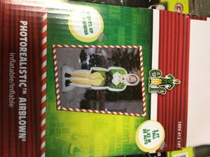 lot 66 image: 6 ft. Pre-lit Inflatable Excited Buddy the Elf-Airblown-WB by Warner Customer Returns See Pictures 
