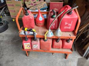lot 678 image: Assorted Gas Cans, Funnels, & Rack...