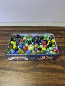 lot 717 image: Assorted Marbles & Shooters in Metal Box