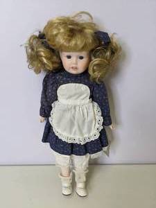 lot 508 image: Porcelain Doll with Pigtails
