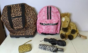 lot 393 image: Animal Print Luggage & Umbrellas