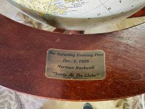 VINTAGE CRAM IMPERIAL WORLD GLOBE IN A TALL WOOD STAND REPLICATED AFTER NORMAN ROCKWELLS SANTA AT THE GLOBE WHICH WAS A COVER FOR THE SATURDAY EVENING POST - GLOBE IS IN EXCELLENT CONDITION SOME SCRATCHING OF WOOD DUE TO AGE..
