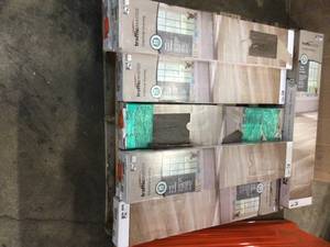 9 Cases of Traffic Master Khaki Oak Dark 6 in. W x 36 in. L Luxury Vinyl Plank Flooring (24 sq. ft.  case) not used see pictures