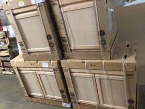 lot 31 image: Lot of  4 Hampton Assembled Kitchen Cabinets in Unfinished Beech by Hampton Bay not used one of them is damaged Customer Returns See Pictures