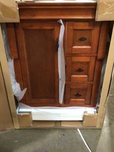 lot 16 image: Naples 24 in. W x 21.63 in. D Bath Vanity Cabinet Only in Warm Cinnamon by Home Decorators Collection Customer Returns See picstures