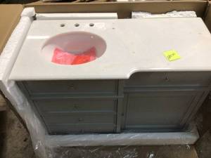 lot 22 image: Hampton Harbor 48 in. Vanity in Dove Grey with Natural Marble Vanity Top in White with White Sink by Home Decorators Collection Customer Returns See Pictures