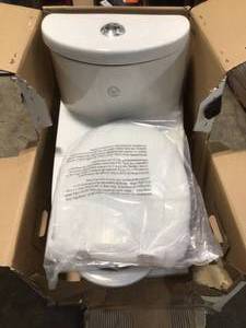lot 26 image: TOTO Dual Flush One-Piece Elongated Chair Height Toilet - Includes Seat see pictures