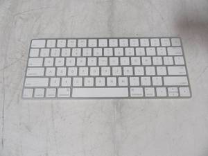 lot 28 image: Apple A1644 Wireless Keyboard with lightning charger port