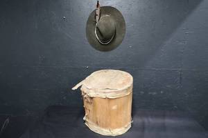 lot 10 image: HAT WITH WOODEN DRUM
