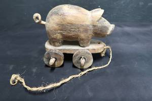 lot 17 image: WOODEN ROLLING PIG