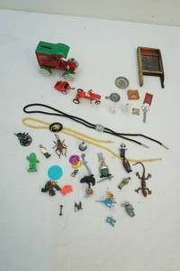 lot 125 image: Toy parts, bank, bolos