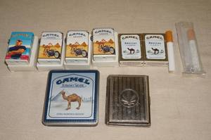 lot 179 image: Vintage Camel Cigarette Lighters and Cases
