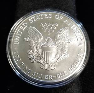 1990 AMERICAN SILVER EAGLE 1 TROY OZ. .999 FINE SILVER IN AIRTITE